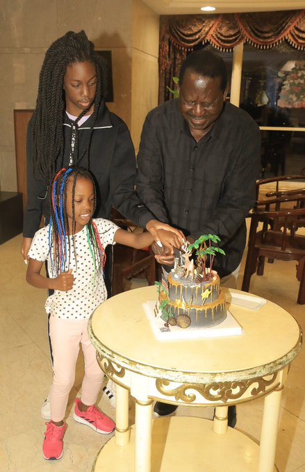 Raila Odinga cuts his birthday cake with his grandchildren