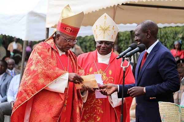 Deputy President William Ruto and John Cardinal Njue (left) during a fundraiser at St Thomas Moore Kairuri Catholic Parish on July 1, 2018