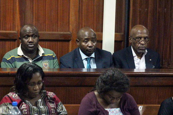 Former ICT Principal Secretary Sammy Ishiundu Itemere, Lugari MP Ayub Savula Angatia and former GAA director Dennis Kuko Chebitwey at the Milimani Law Courts on March 27, 2019 over the theft of Sh122 million from the ministry.