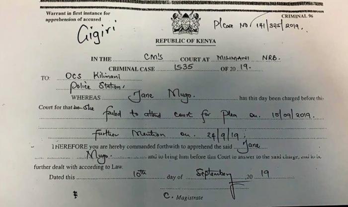 An arrest warrant issued by the DCI against her.