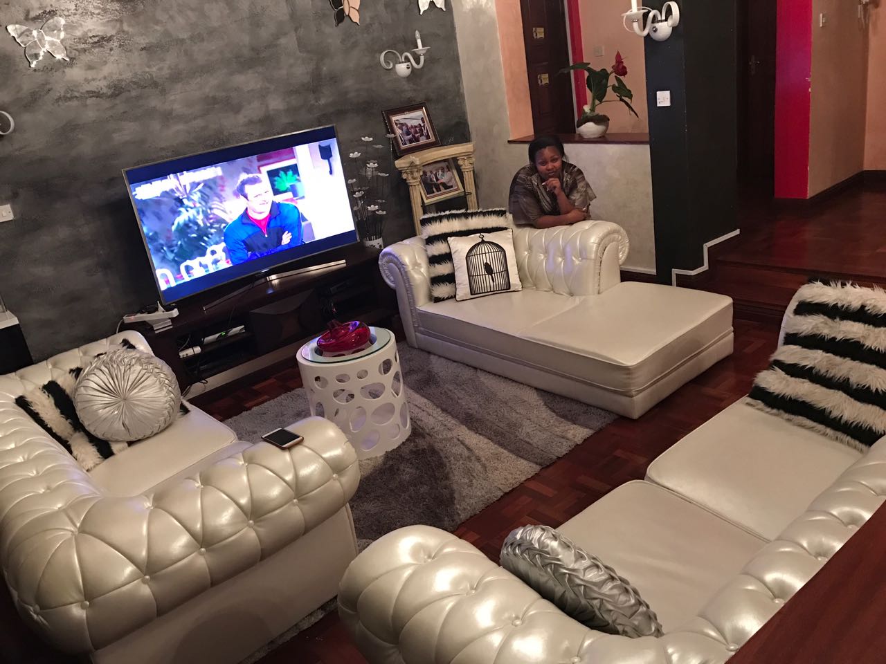 A photo showing the living room of Omanga's house.