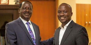 ODM party leader Raila Odinga and his new Press Secretary in his Campaign Secretariat, Dennis Onsarigo.
