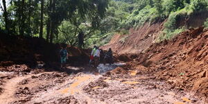 A section of road covered in landslide