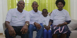Safaricom Chief Corporate Security Officer Nicholas Mulila (far left) seated with Reuben Komen Keitany and his family in the apartment he won during the Lipa na M-Pesa promotion on January 24, 2020