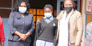 Woman Rep Rahab Mukami with Abigail Njeri and her mother.