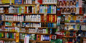 Cosmetic products displayed on a shelf in a shop