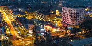 An aerial photo of a town lit at night.