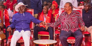 Former Prime Minister Raila Odinga holding hands with Former President Uhuru Kenyatta during the Jubilee Party NDC on May 22, 2023.