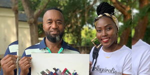 Artist Yvonne Siralie presenting a painting to Mombasa Governor Hassan Joho