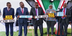 From left CS Joe Mucheru, CS James Macharia, CS Fred Matiang'i and other government officials displaying new digital number plates in Nairobi on August 30, 2022