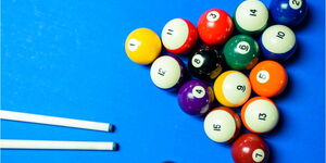 A photo of pool balls on a pool table