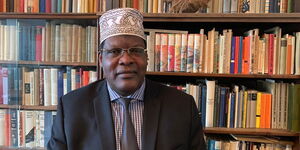 A photo of Miguna Miguna (pictured) in a library in Toronto on January 23, 2020
