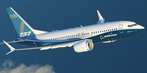 A Boeing 737 plane while flying in the sky