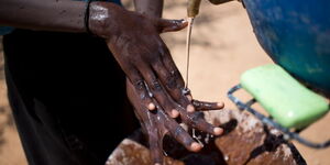 A boy washes his hands at the Kotela Primary School in Kotela in Turkana County on 30 September 2014.