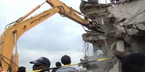 A bulldozer demolishes a house in Eastleigh in 2011