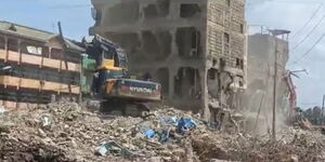A bulldozer demolishing a multiple-storey building in Jamhuri Estate,  Thika Town on Wednesday, December 6, 2023.