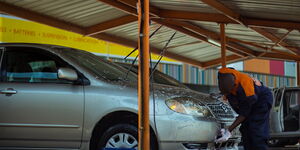 A carwash attendant at work.