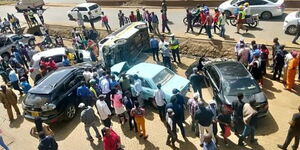 A crowd gathered in Thika town after a multiple-car crash on Tuesday, January 10, 2023