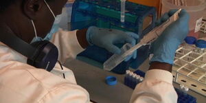 A doctor carries out a test in a laboratory