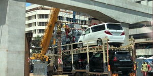 A flatbed truck stuck under  Nairobi Expressway Bridge at Haille Selassie roundabout on Sunday, October 31, 2021.