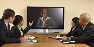 A group of staffers at a boardroom