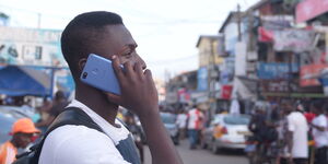 Photo of a man using a phone in Nairobi