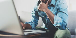 A man working using a laptop. Following the Covid-19 outbreak, working from home is the new normal