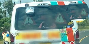 A photo of children in the boot of a matatu operating in Nakuru County 