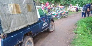 A police car outside a house in Kapcheplim Village, Elgeyo Marakwet County where bodies of a mother and three children were found on Saturda, July 25, 2020.