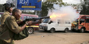 A police officer launching a teargas canister during an operation. On Friday, May 22, 2020, officers carrying out a curfew enforcement operation in Huruma area, Nairobi, launched a canister that landed next to a 2-month-old baby.