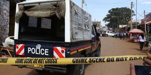 An undated image of a police vehicle at a scene of a crime