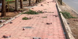A technician laying down cabro paving in Nairobi.