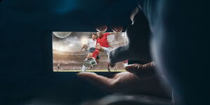 A user watching football on a phone using Showmax.