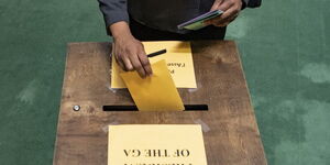 A voter casting a ballot at the United Nations General Assembly on June 17, 2020.