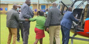 A woman Attempting to Speak to Interior CS Held Back By Police Officers.