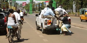 A woman being dragged by askaris in Kisumu County