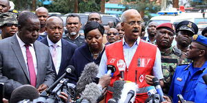 Former Kenya Red Cross Secretary General Abbas Gullet (centre) addresses journalists outside the dusitD2 office park on January 16, 2019 after a terrorist attack 