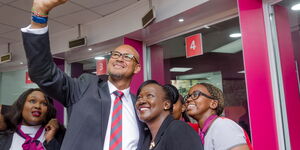 Absa Bank Kenya PLC Managing Director Jeremy Awori shares a selfie moment with his staff on February 10, 2020.