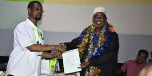 MP-elect for Mandera West Constituency Adan Haji Yussuf receiving his election certificate on August 12, 2022.