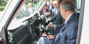 Adil Popat (left) with President Uhuru Kenyatta inside the Mahindra cab at State House grounds Nairobi on March 9, 2020.