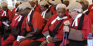 Judges wearing their ceremonial robes and wigs
