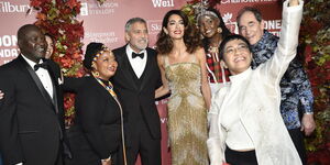 American movie star George Clooney (theird left), hiswife Amal (fourth left), Kenyan Josephine Kulea (third right) and other guests at the Albie Awards in New York City on Friday, September 30, 2022.