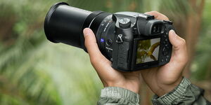 An Undated File Image of A Person Holding A Camera.