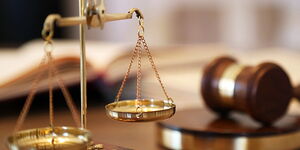 An image of  a legal scale and a gavel.
