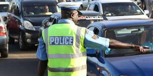 An image of a traffic police officer manning traffic on a road in Nairobi.jpg