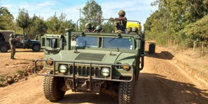 An military vehicle escorts students from Ol Moran Secondary School on Saturday, October 3, 2021.