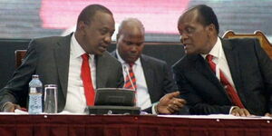 An undated photo of President Uhuru Kenyatta speaking to Marsden Madoka 