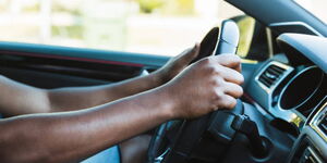 An undated photo of a man behind the wheel