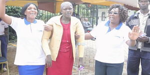 Anne Kamama (centre) after being discharged from Top Hill Hospital in Eldoret on Friday, March 27, 2020