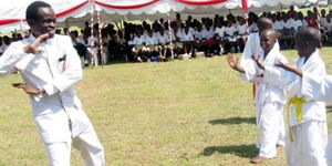 Fomrer Anti-Corruption Commission boss Patrick Lumumba gives Karate lessons to Loreto Primary School pupils in Mombasa. July 26, 2010
